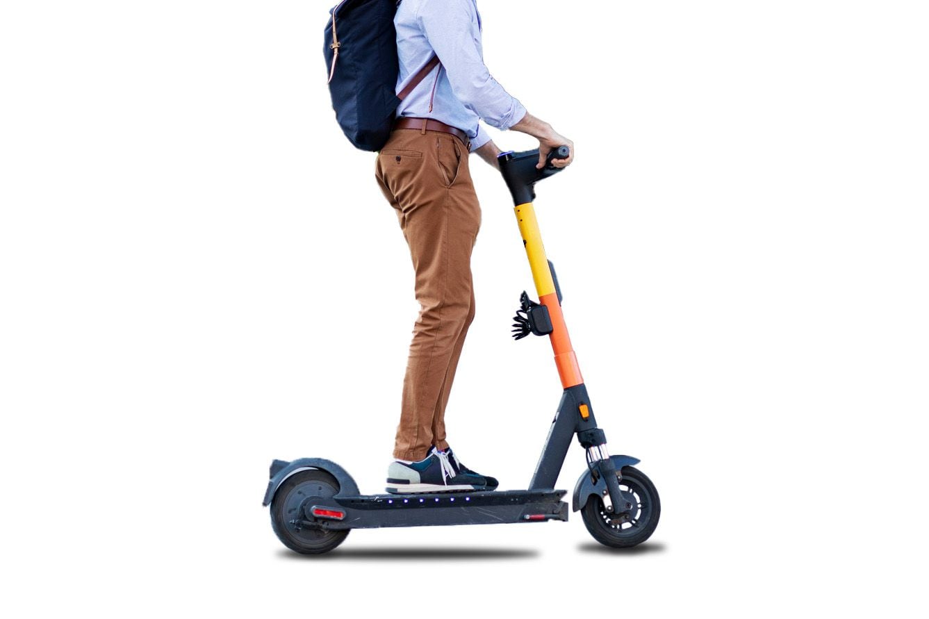 Person standing on electric kick scooter